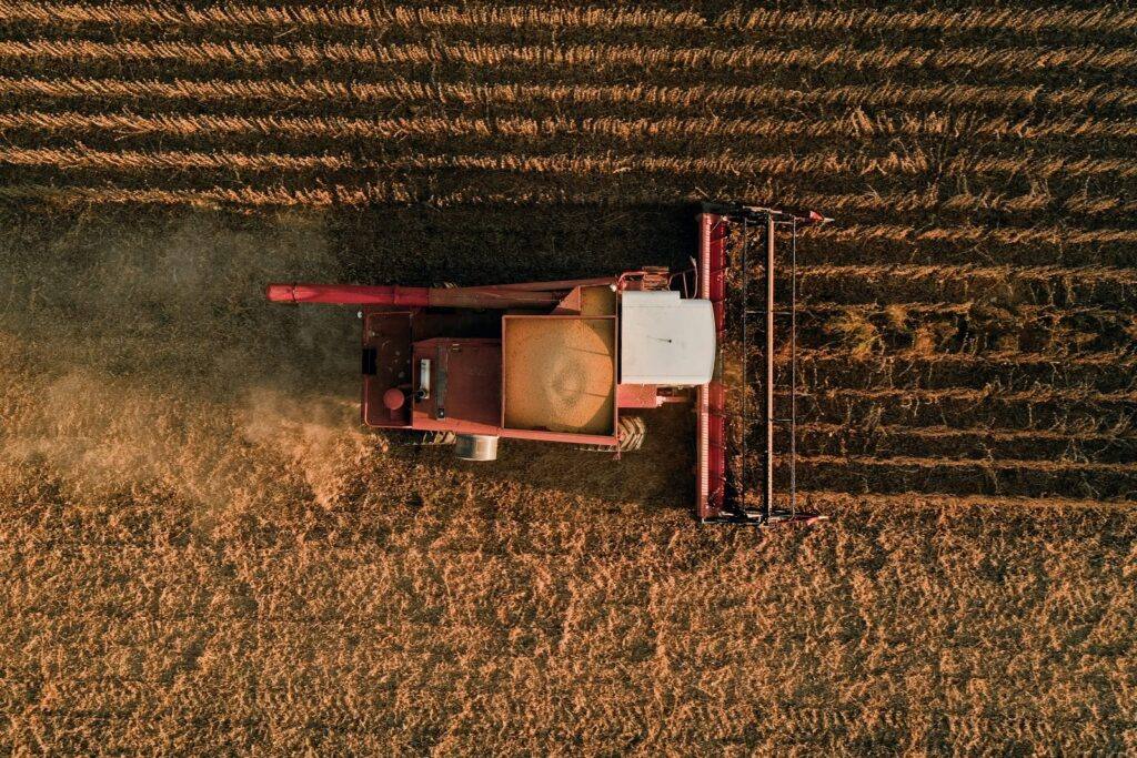 Tractor harvesting a soybean field