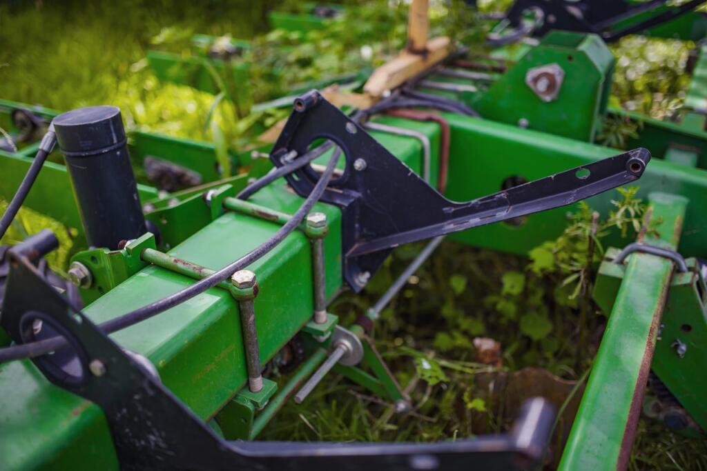 Tractor tilling soil close-up